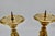 Set of two matching brass pillar candleholders. These decorative pieces are perfect for adding flair to a dining room,...