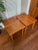 A pair of gorgeous teak side tables by A.B.J. Denmark. These tables feature opposing wood grain directions, creating an...