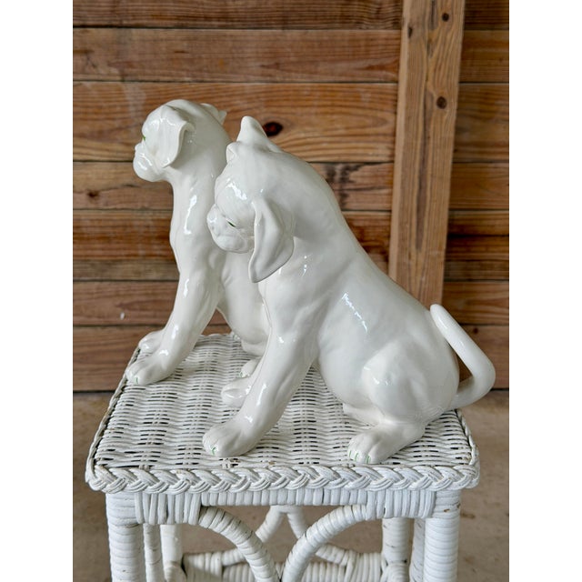 An irresistibly charming pair of mid-century Italian ceramic Boxer puppy figures by Ronzan. Beautifully modeled with...