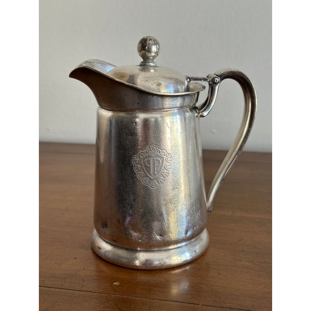 An elegant vintage silverplate tea or coffee pot bearing the engraved Plaza Hotel monogram, a rare and collectible piece...