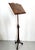 Made in Italy, 1950s- 1960s. This adjustable music stand /book stand is made of hand-carved walnut with a 19th century...
