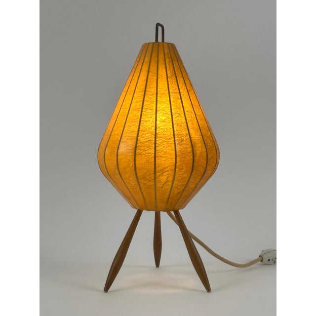 Extremely rare, elegant and highly decorative mid century modern cocoon table lamp. Designed and manufactured probably in...