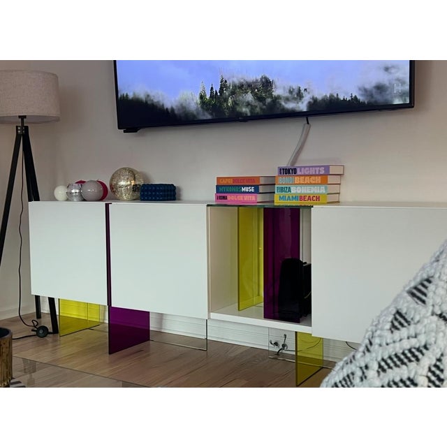 René Bouchara designed Diapo is a Sideboard with 3 doors and central niche Structure in lacquered MDF, base in laminated...