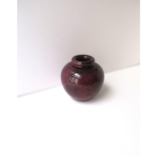 A beautiful and substantial Italian red burgundy, with black veining, marble urn form vase or vessel, Italy. Made from one...