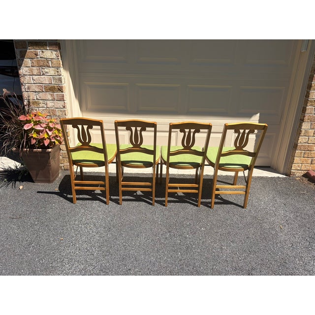 Add classic mid-century elegance and space-saving functionality to your home with this exceptional set of four (4) 1950s...