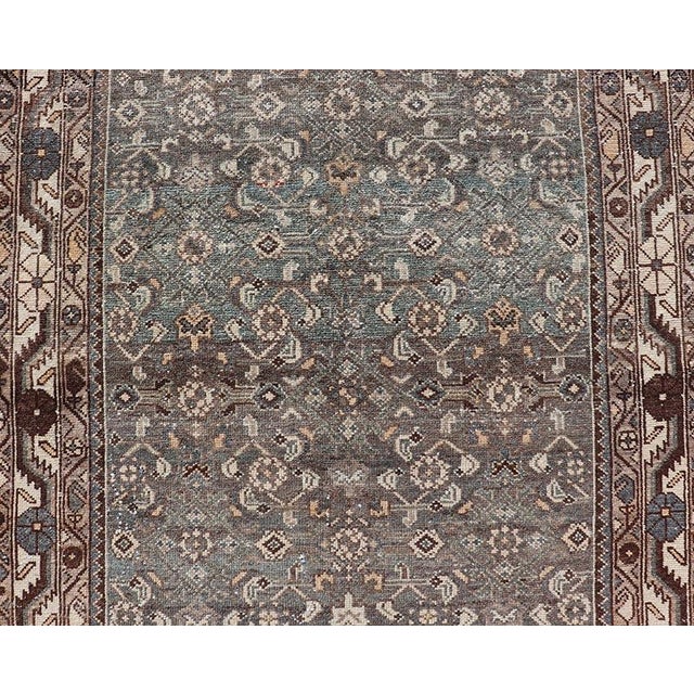 Measures: 3'6 x 10'3 This antique Persian Malayer displays the Herati design, however this one-of-a-kind piece features a...