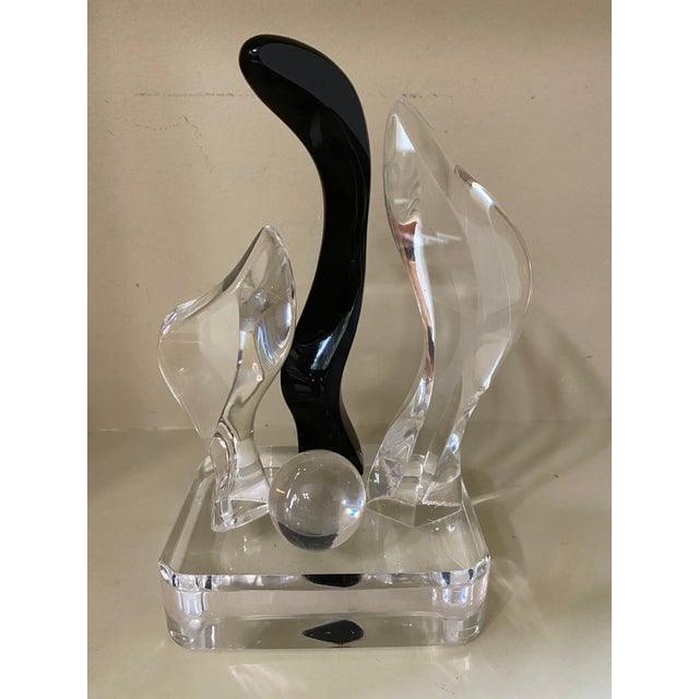 Starting from solid acrylic material, each sculpture is bandsaw-cut into its component pieces. The material, solidly...