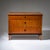 Three-drawer Biedermeier chest of drawers raised on shaped tapered square legs with ebonized moldings and escutcheons. The...