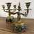 Pair of gilt bronze candelabra on a black/dark green marble base in the Louis XV style, characterized by curved,...