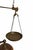 Beautiful antique brass balance scale featuring a classic hanging pan, sliding counterweight, and an integrated candle...