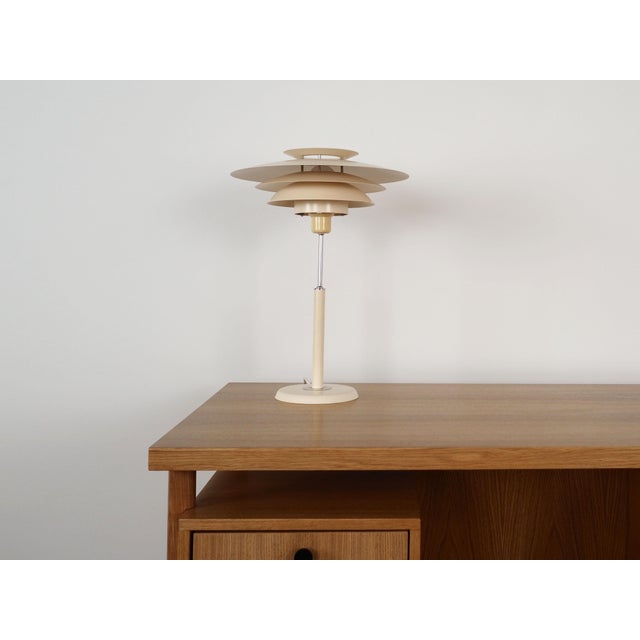 The lamp was made in the 1970s, Danish production. The lamp is made of metal in beige. Condition: Lamp in original...