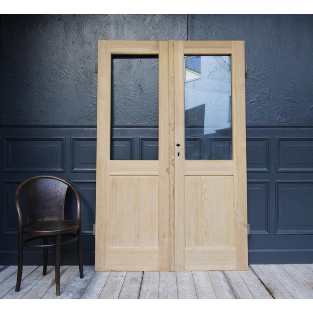 Pine wood double door from Switzerland. Early 20th century. Unrestored. Double door consisting of two originally half-...