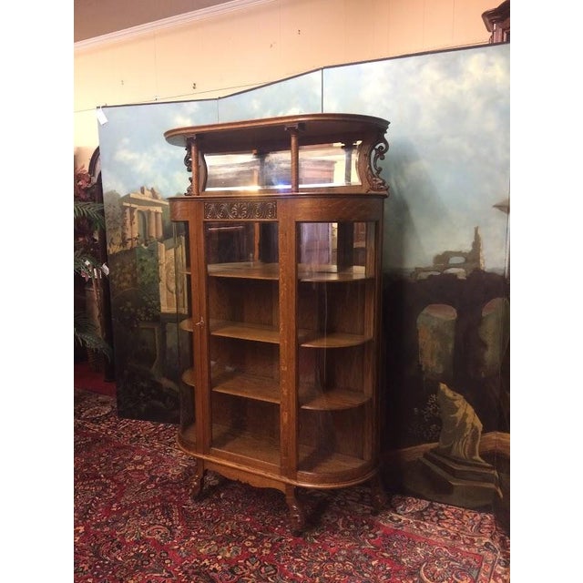 Item: Antique Oak China Cabinet. Age & Condition: Circa 1880. Good, refinished condition. Signs of age to the mirror...