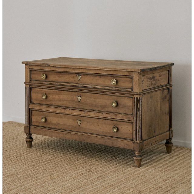 19th Century Directoire commode dresser, France. This chest of drawers in the Directoire style features the classic fluted...