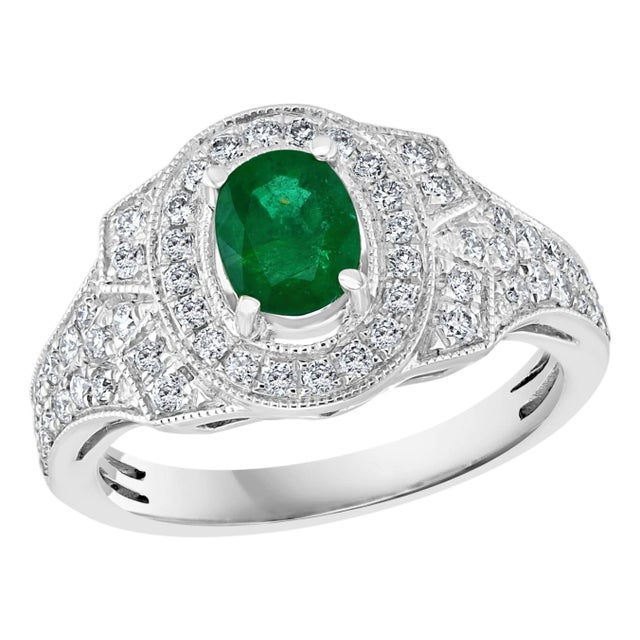 0.80 Carat Oval Cut Emerald and 0.85 Carat Diamond Ring 18 Karat White Gold For Sale
