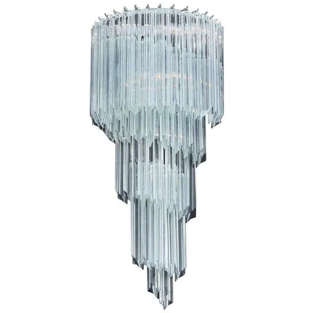 Italian wall light with clear Murano glass hand blown into four points using Quadriedri technique, mounted on chrome metal...