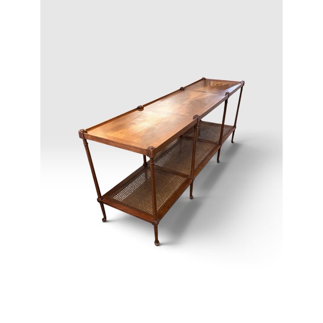 A striking and exceptionally long vintage console or sofa table by Baker Furniture, retaining its original Baker Furniture...