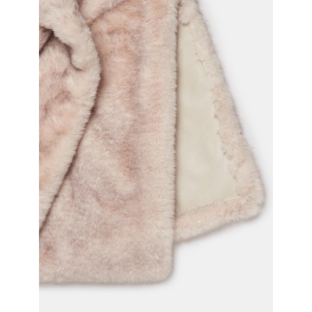 A luxurious, handcrafted throw made in Como, Italy. One side features ultra-soft faux fur for warmth and comfort, while...