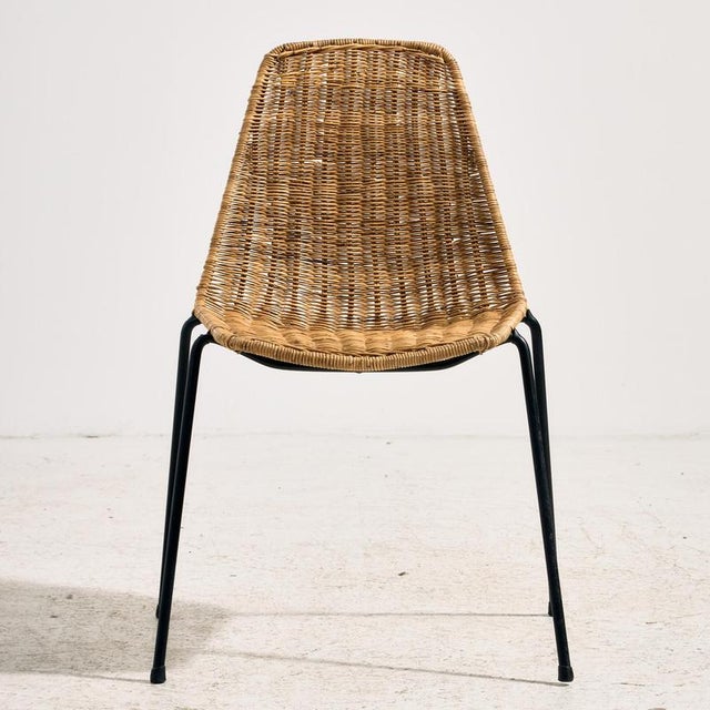 The ‘Basket’ chair designed by Gian Franco Legler in the 1950s. The chair’s frame is made of metal, while the seat and...