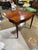 A beautiful early 19th century mahogany Sheraton style flip top game table. Sides are in a serpentine style with outset...