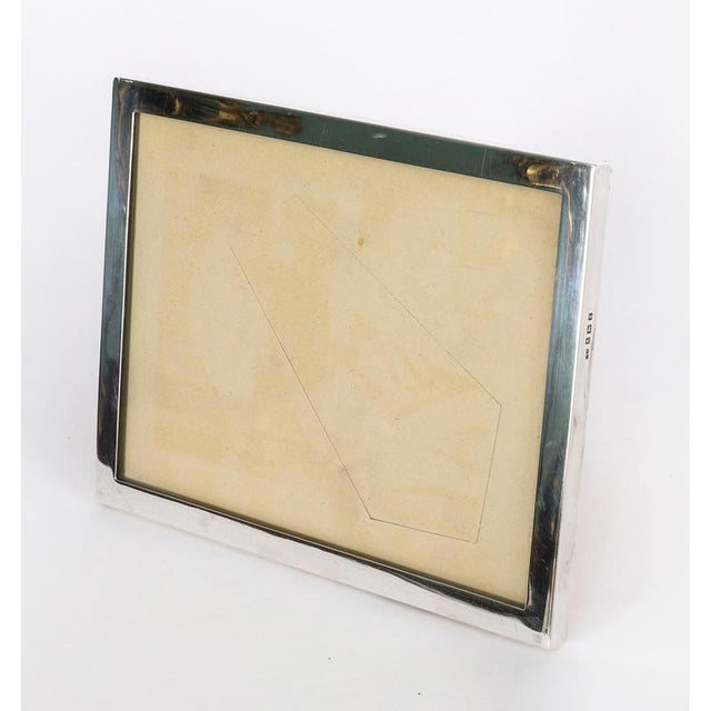 A truly superb, large decorative sterling silver photo frame with hallmarks for Birmingham 2024. This rectangular portrait...
