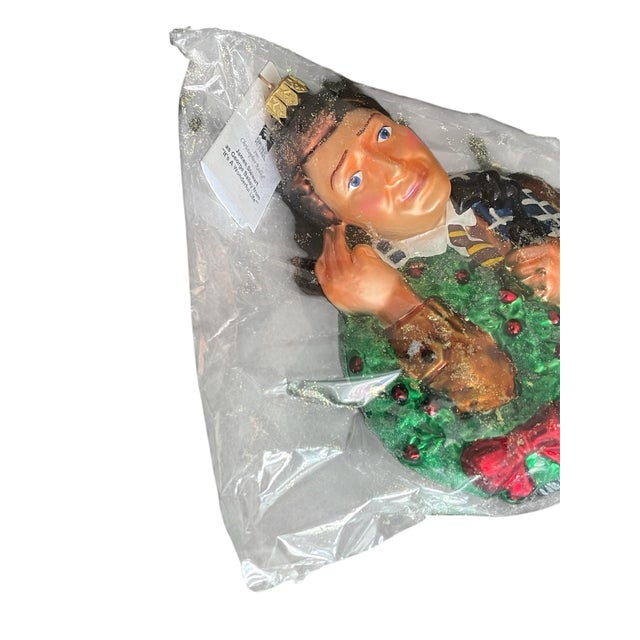 A rare and highly collectible Christopher Radko glass Christmas ornament depicting James Stewart as George Bailey from the...
