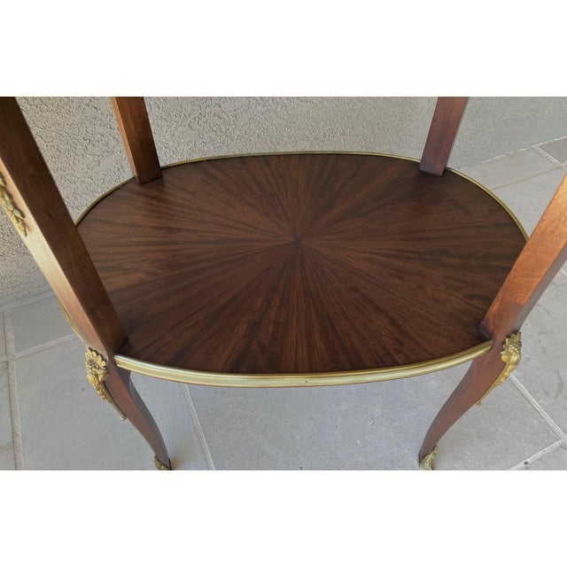 Burnt Umber Circa 1930 Louis XVI-Style Mahogany Starburst Marquetry Two-Tier Oval Accent Table With Brass Mounts For Sale - Image 8 of 18