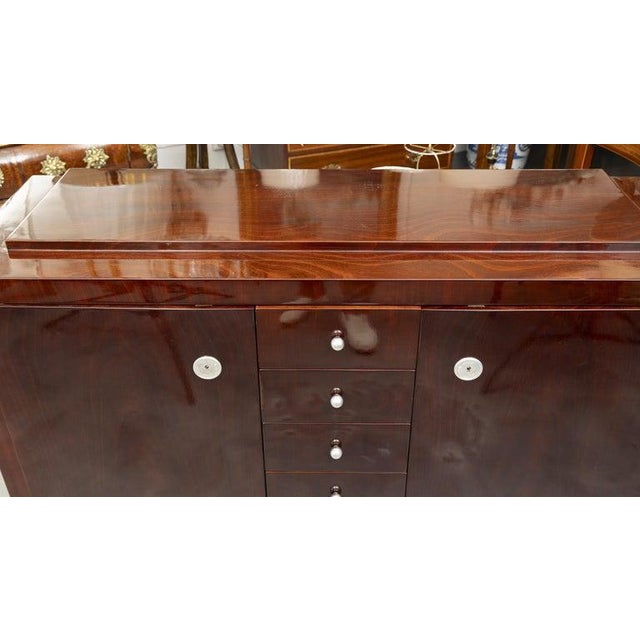 This is a sophisticated French Art Deco credenza/dresser crafted in richly figured mahogany, showcasing the sleek geometry...