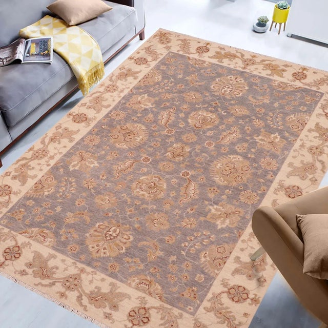 "Enhance the ambiance of your home with this magnificent Persian-influenced Turkish hand-knotted rug made by skilled...