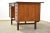 A mid century modern teak double bank desk with a finished back and a drawer for hanging files. Made in Denmark....