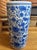 A gorgeous Chinoiserie blue and white porcelain umbrella or cane stand surrounded by florals. Made in China, Late 20th...