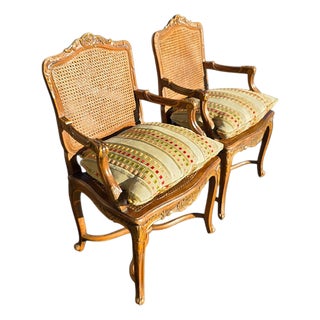 Pr of Early 20th Century French Louis XV Style Carved Walnut Fauteuils W/Cane Seats & Backs, Original Painted Highlights W/Loose Upholstered Cushions For Sale