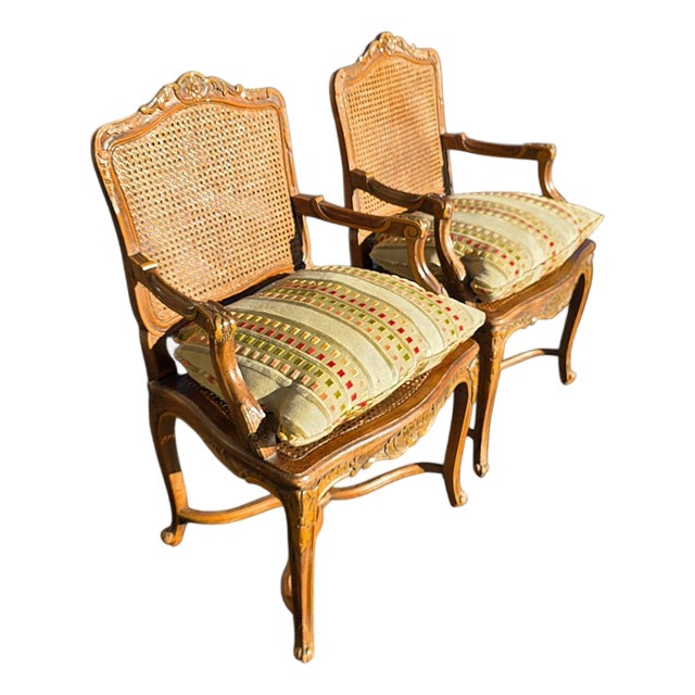 Pr of Early 20th Century French Louis XV Style Carved Walnut Fauteuils W/Cane Seats & Backs, Original Painted Highlights W/Loose Upholstered Cushions For Sale