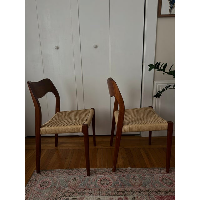 Iconic Model 71 dining chairs designed by Niels Otto Møller for J.L. Møllers Mødelfabrik in Denmark, 1960s. Crafted from...