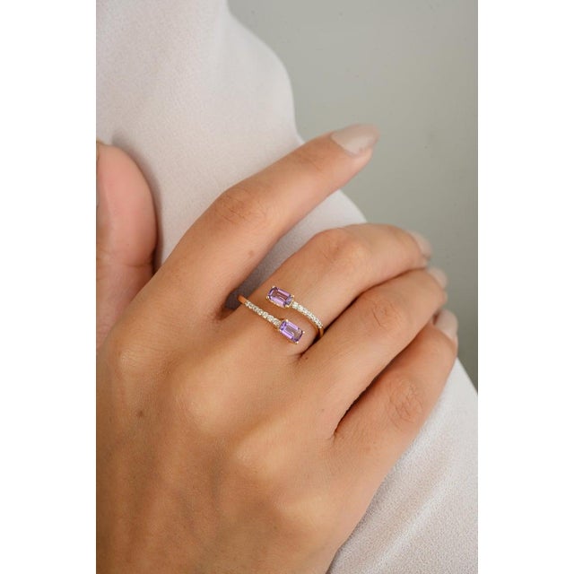 Dainty Two Stone Amethyst By Pass Ring in 14K Gold featuring natural amethyst of 0.5 carats and diamonds of 0.1 carats....