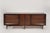 A Mid-Century Modern walnut dresser expertly restored by Stamford Modern. Features six large drawers and bookmatched...
