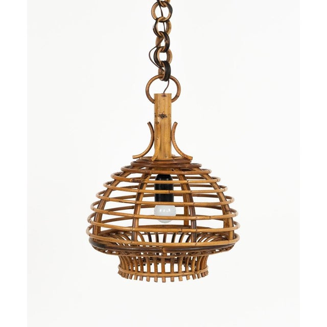 Midcentury beautiful hand-crafted chandelier in bamboo and rattan with rattan chain. Made in Italy in the 1960s. They are...