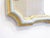 This small Italian mirror with gilded edges has a distressed mirrors with clouding & speckling, and measures 15"H x 10.25"W.