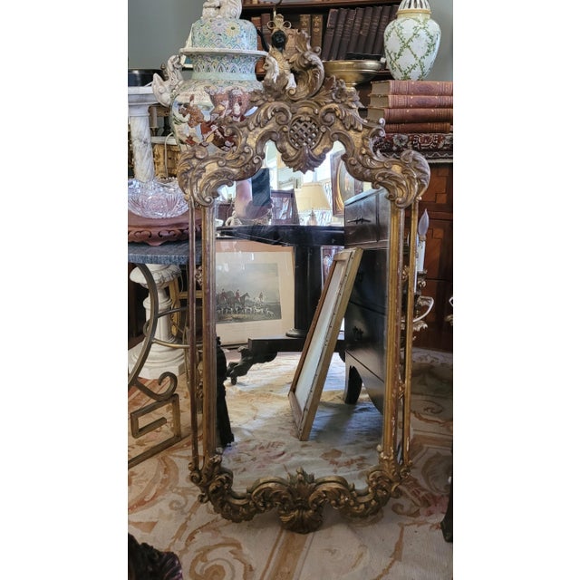 Fabulous antique French guilt wall mirror. Measuring 21 inches wide by 44 in tall and 2 in deep. Some minor repairs fading...
