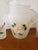 This is a Hazel Atlas Frosted Pitcher and 4 Matching Glasses With Floral Motif. The pitcher measures 9 1/8" high and 7...