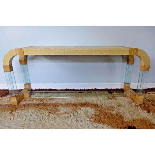 Grasscloth and Glass Waterfall Console Table Fabulous waterfall console table is a stunning architectural piece....