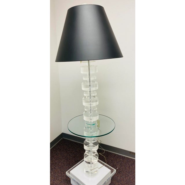 Mid-century Modern lucite floor with glass table. This show stopper will look fabulous in a variety of home interiors....