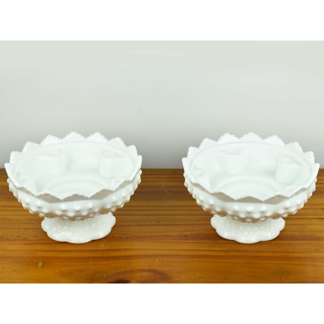 This authentic pair of Fenton milk glass bowls features the iconic "Hobnail" pattern and the original 1970s-era embossed...