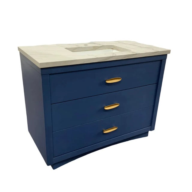 A handsome vintage bow-front dresser thoughtfully converted into a distinctive single-sink bathroom vanity. The cabinet...