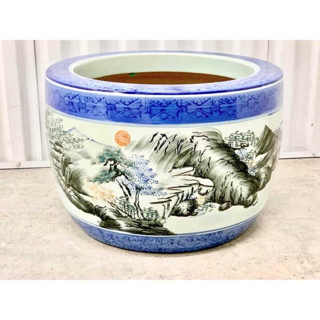 Enhance your home with this stunning vintage Chinese blue and white porcelain fishbowl planter. This classic cachepot...