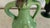 A vintage German ceramic vase marked “Germany 850” on the underside. The piece has a sculptural double-handle amphora form...