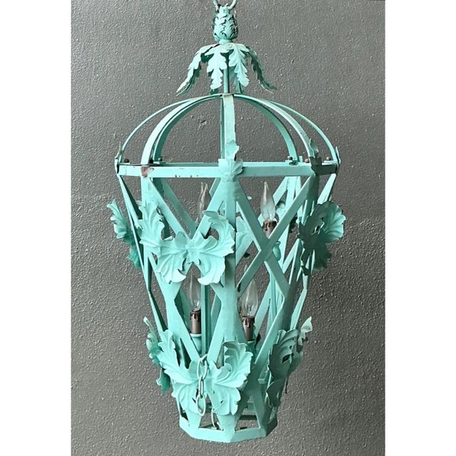 This vintage hanging lantern takes an elegant tapered, tent-like silhouette, its open latticework body formed from...