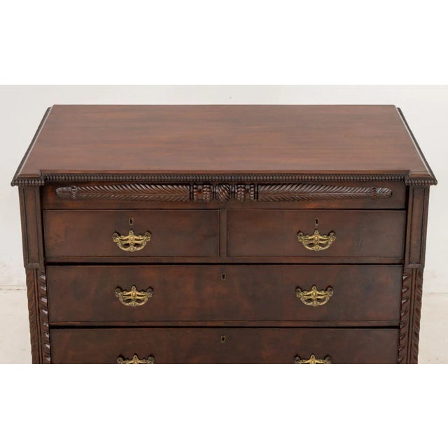 American Empire Mahogany Chest of Drawers, 19th century, having two short drawers above three graduate frieze drawers on...