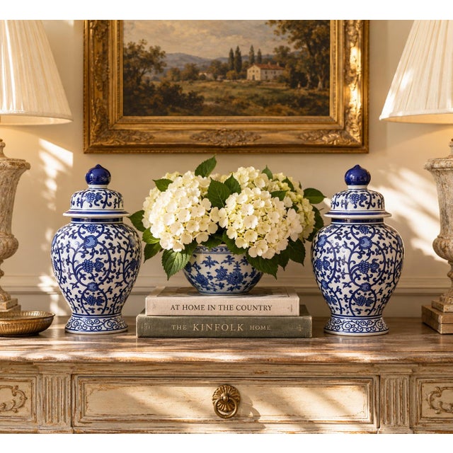 A classic pair of blue and white ginger jars, decorated throughout with delicate Chinese floral motifs. The pattern is...