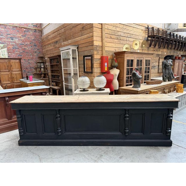This vintage fir wood display case has been fully restored. It features a black-patinated frame and a large, unfinished...